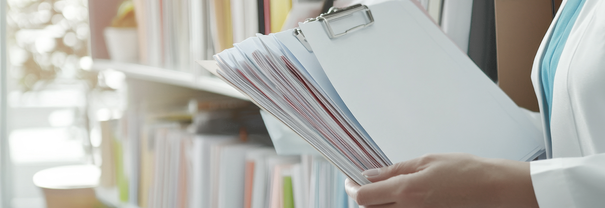 staff holding paperwork